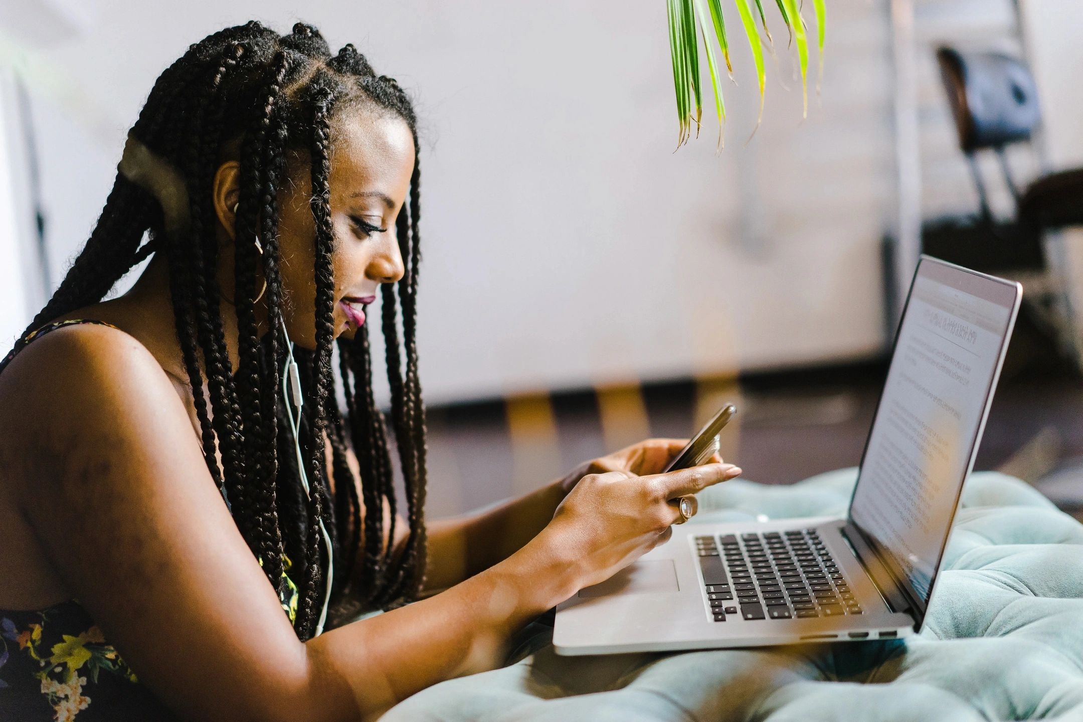 Affordable Online Bachelor's Degrees in Business - african american woman studying on laptop for business degree online
